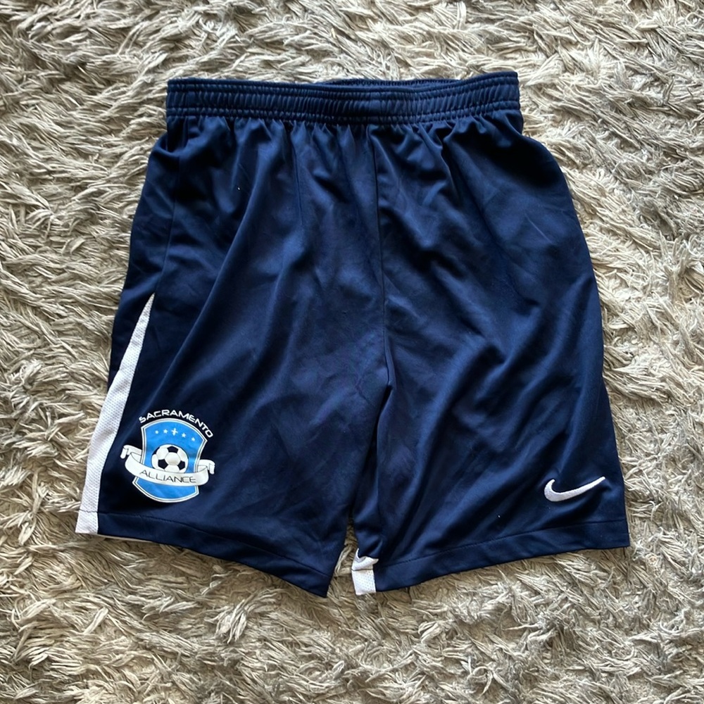 Navy blue Dri-fit soccer shorts.